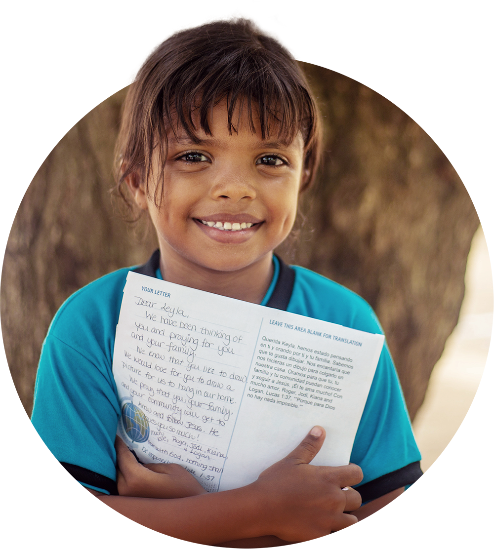 Supported child with letter